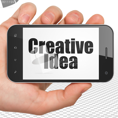 Image of Business concept: Hand Holding Smartphone with Creative Idea on display