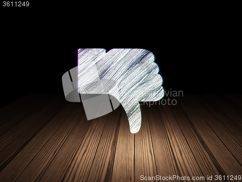 Image of Social network concept: Thumb Down in grunge dark room