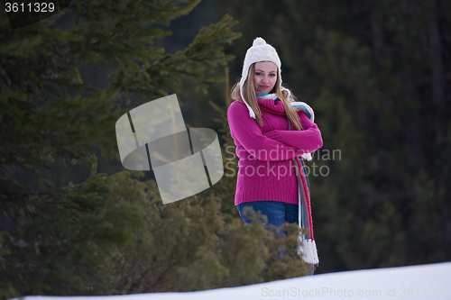 Image of portrait of beautiful young redhair woman in snow scenery