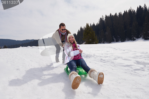 Image of happy young couple having fun on fresh show on winter vacation