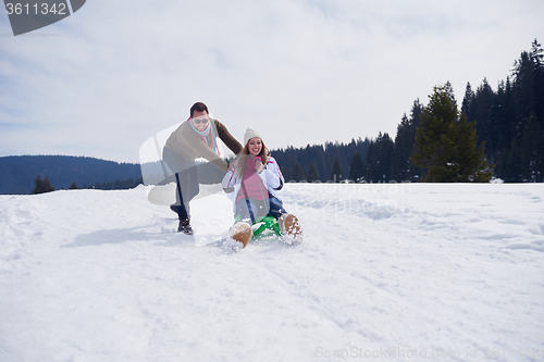 Image of happy young couple having fun on fresh show on winter vacation