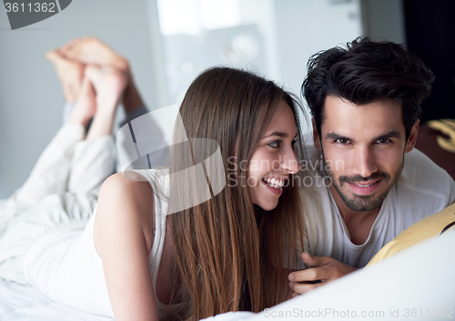 Image of couple relax and have fun in bed