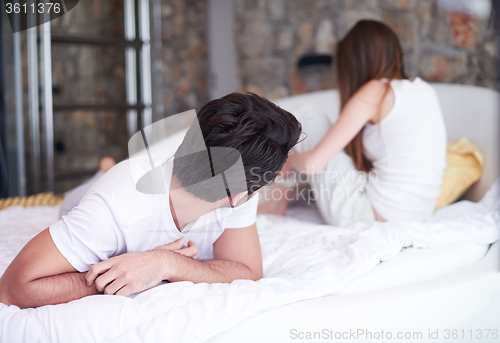 Image of couple relax and have fun in bed