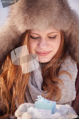 Image of winter girl with gift