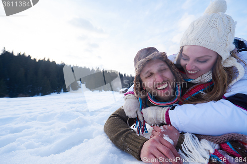 Image of romantic young couple on winter vacation