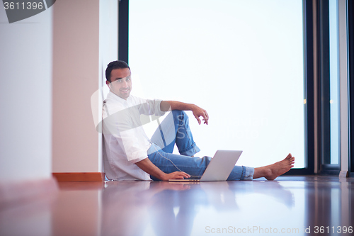 Image of working on laptop computer from home