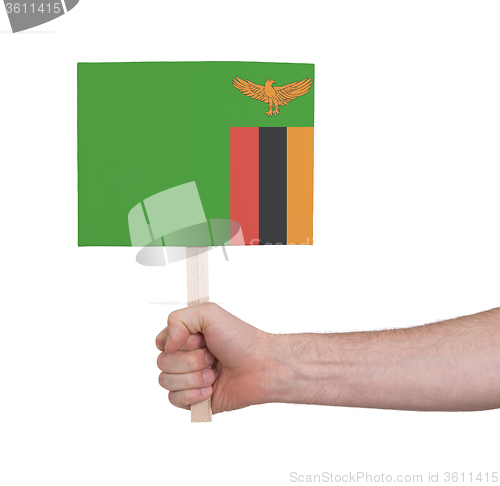 Image of Hand holding small card - Flag of Zambia