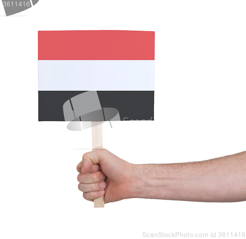 Image of Hand holding small card - Flag of Yemen