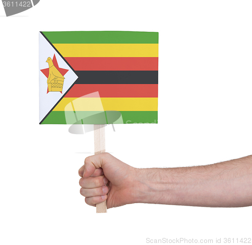 Image of Hand holding small card - Flag of Zimbabwe