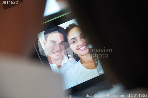 Image of couple at modern home using tablet computer