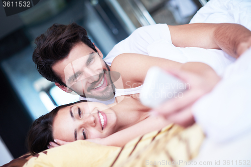 Image of couple relax and have fun in bed