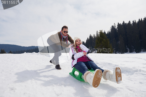 Image of happy young couple having fun on fresh show on winter vacation