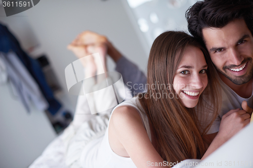 Image of couple relax and have fun in bed