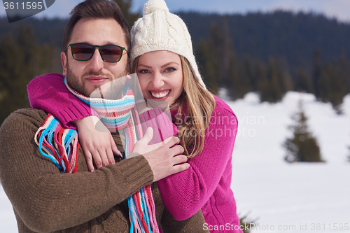 Image of romantic young couple on winter vacation