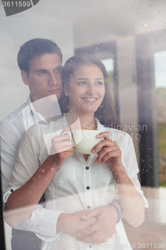 Image of relaxet young couple drink first morning coffee