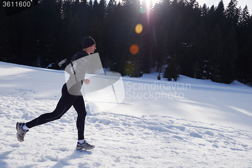 Image of jogging on snow in forest