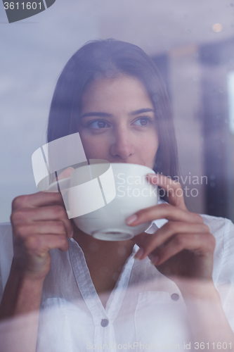 Image of beautiful young woman drink first morning coffee