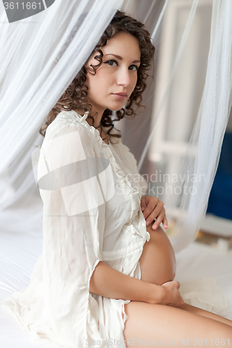 Image of The pregnant woman wearing white clothes