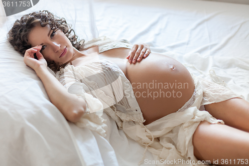 Image of The pregnant woman wearing white clothes
