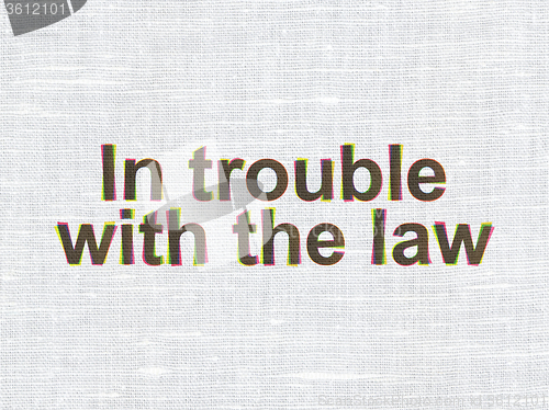 Image of Law concept: In trouble With The law on fabric texture background
