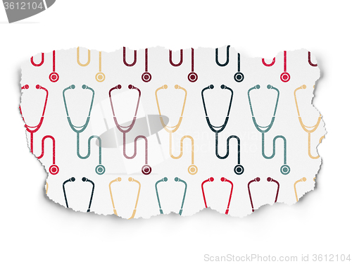 Image of Health concept: Stethoscope icons on Torn Paper background