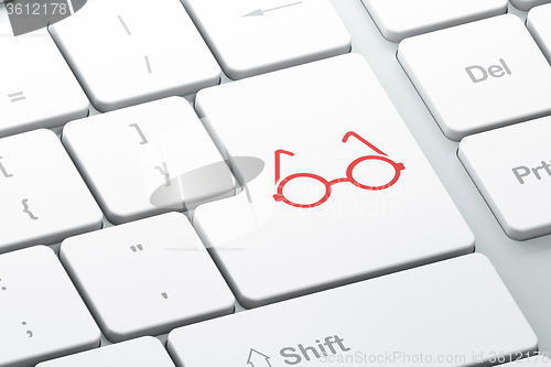 Image of Science concept: Glasses on computer keyboard background