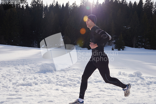 Image of jogging on snow in forest