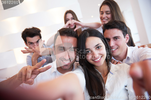Image of group of friends taking selfie