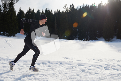 Image of jogging on snow in forest