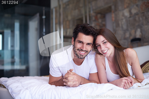 Image of couple relax and have fun in bed