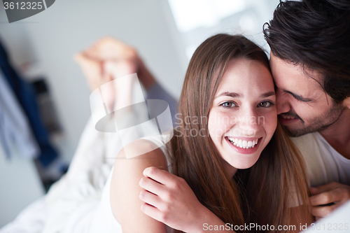 Image of couple relax and have fun in bed