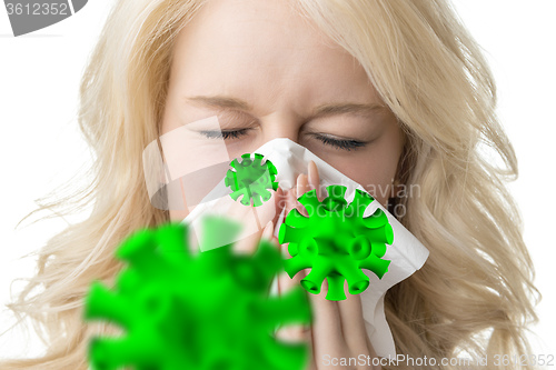 Image of Ill woman with tissue is sneezing virus