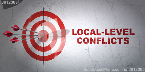 Image of Politics concept: target and Local-level Conflicts on wall background