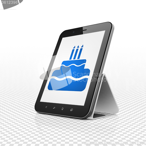 Image of Holiday concept: Tablet Computer with Cake on display