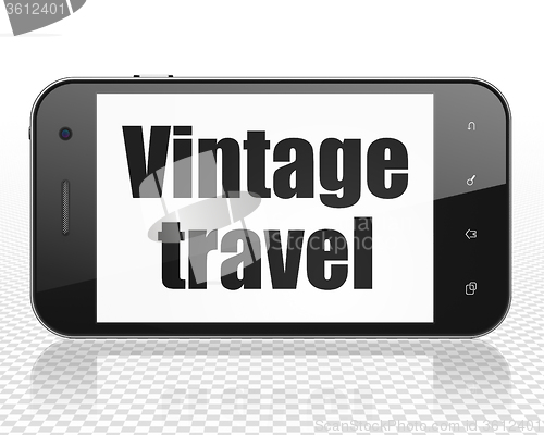 Image of Travel concept: Smartphone with Vintage Travel on display