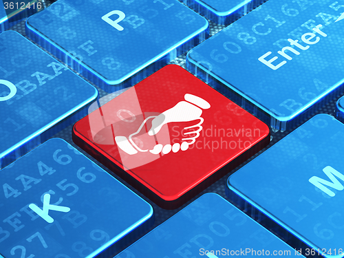 Image of Politics concept: Handshake on computer keyboard background