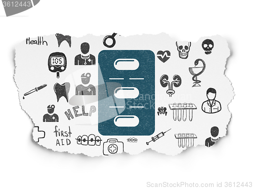 Image of Healthcare concept: Pills Blister on Torn Paper background