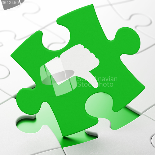 Image of Social network concept: Thumb Down on puzzle background