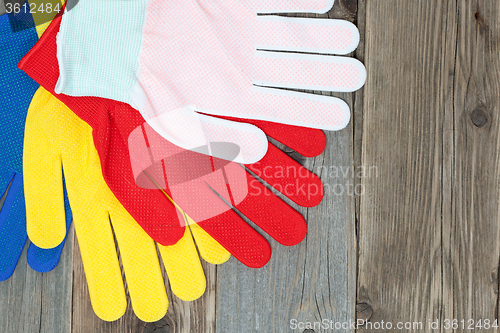 Image of set of four colored construction gloves