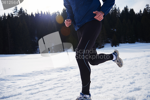 Image of jogging on snow in forest