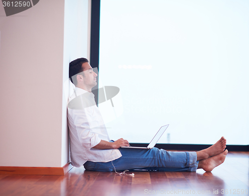 Image of working on laptop computer from home