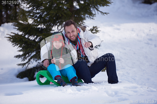 Image of portrait of father and son on snow