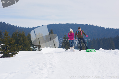 Image of happy young couple having fun on fresh show on winter vacation