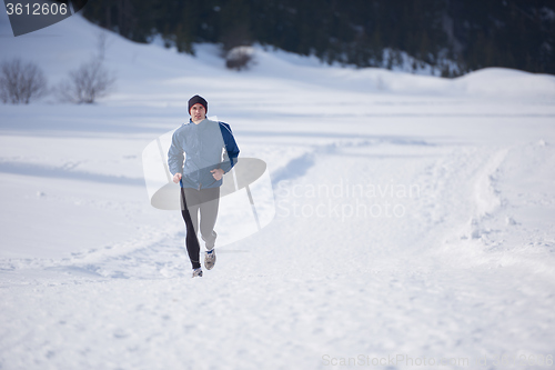 Image of jogging on snow in forest