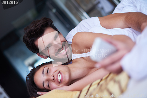 Image of couple relax and have fun in bed