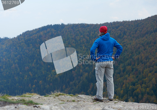 Image of advanture man with backpack hiking