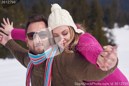 Image of romantic young couple on winter vacation