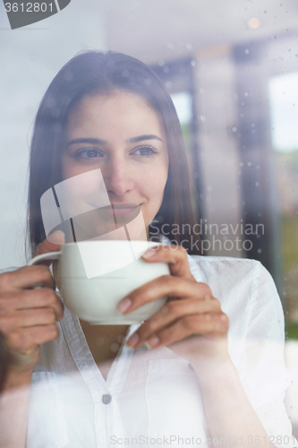 Image of beautiful young woman drink first morning coffee