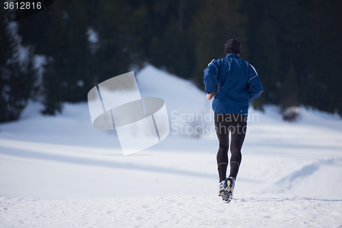 Image of jogging on snow in forest