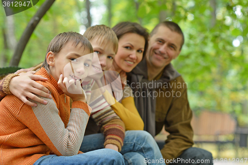 Image of Family of four sitting